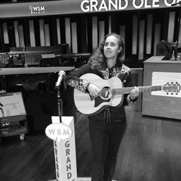 Maddy with guitar at Grand Ole Opry.