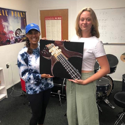 Maddy with student with Bass painting.